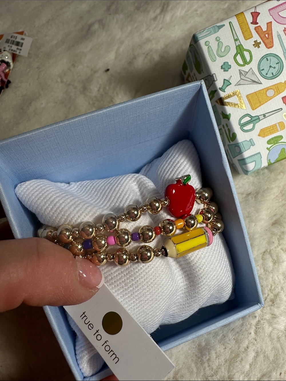 True to form set of 3 gold stretchy teacher bracelets with charms